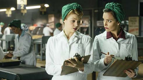 Ali Liebert as Betty and Jodi Balfour as Gladys in Bomb Girls: Facing the Enemy