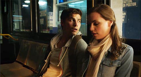 Young man and woman on bus.