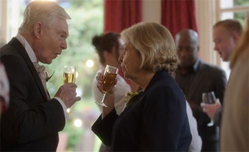 Alan and Celia drink a toast