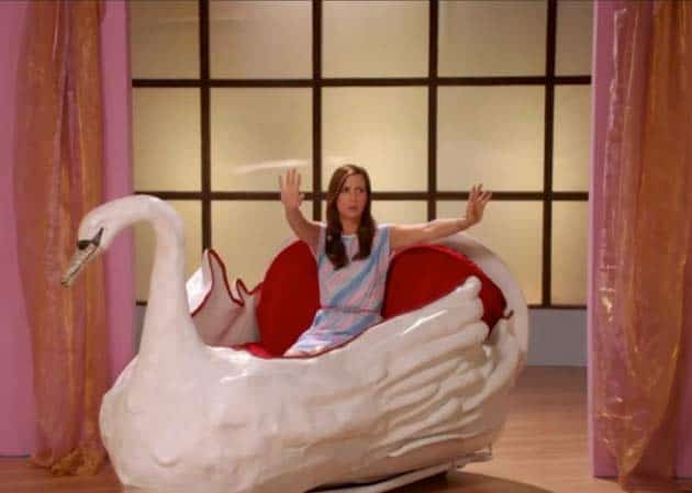 Kristen Wiig riding in a big swan