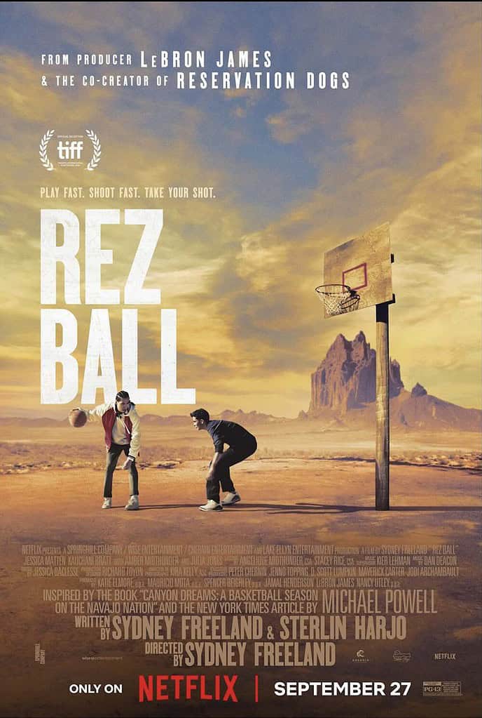 The poster for Rez Ball shows two Navajo boys shooting baskets on a dusty spot in the desert. Behind them is the imposing view of Shiprock.